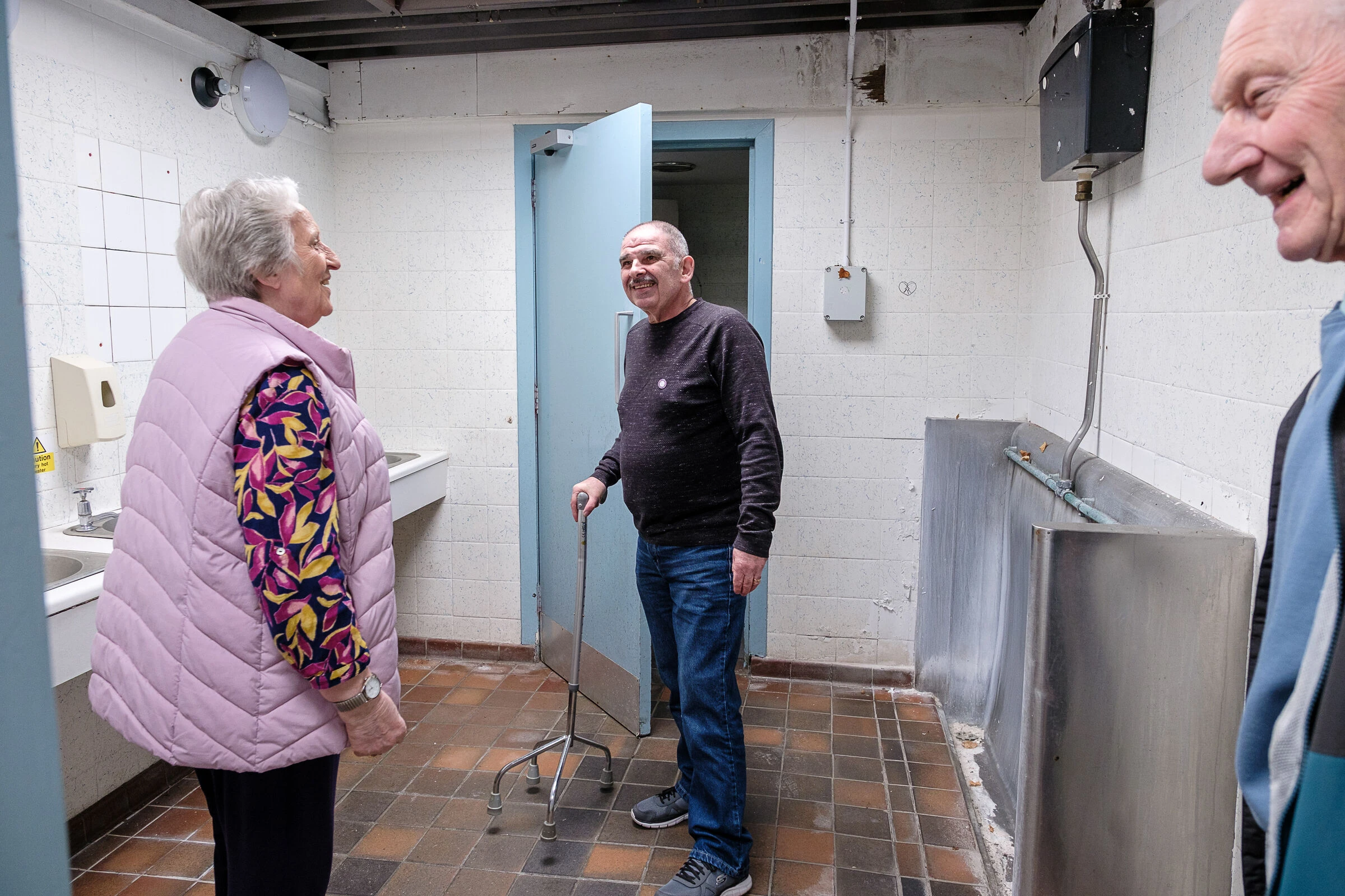 Members of Ray's Opportunities exploring the accessible toilet space together